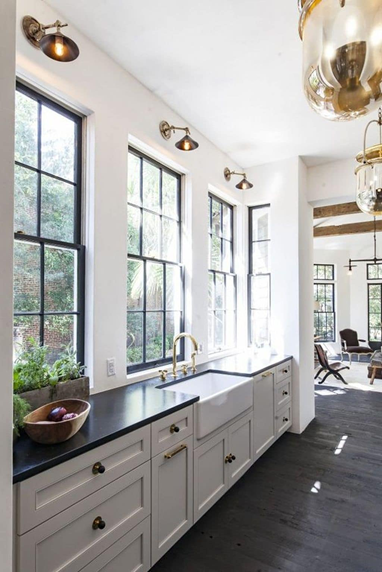Dark windows in white kitchen